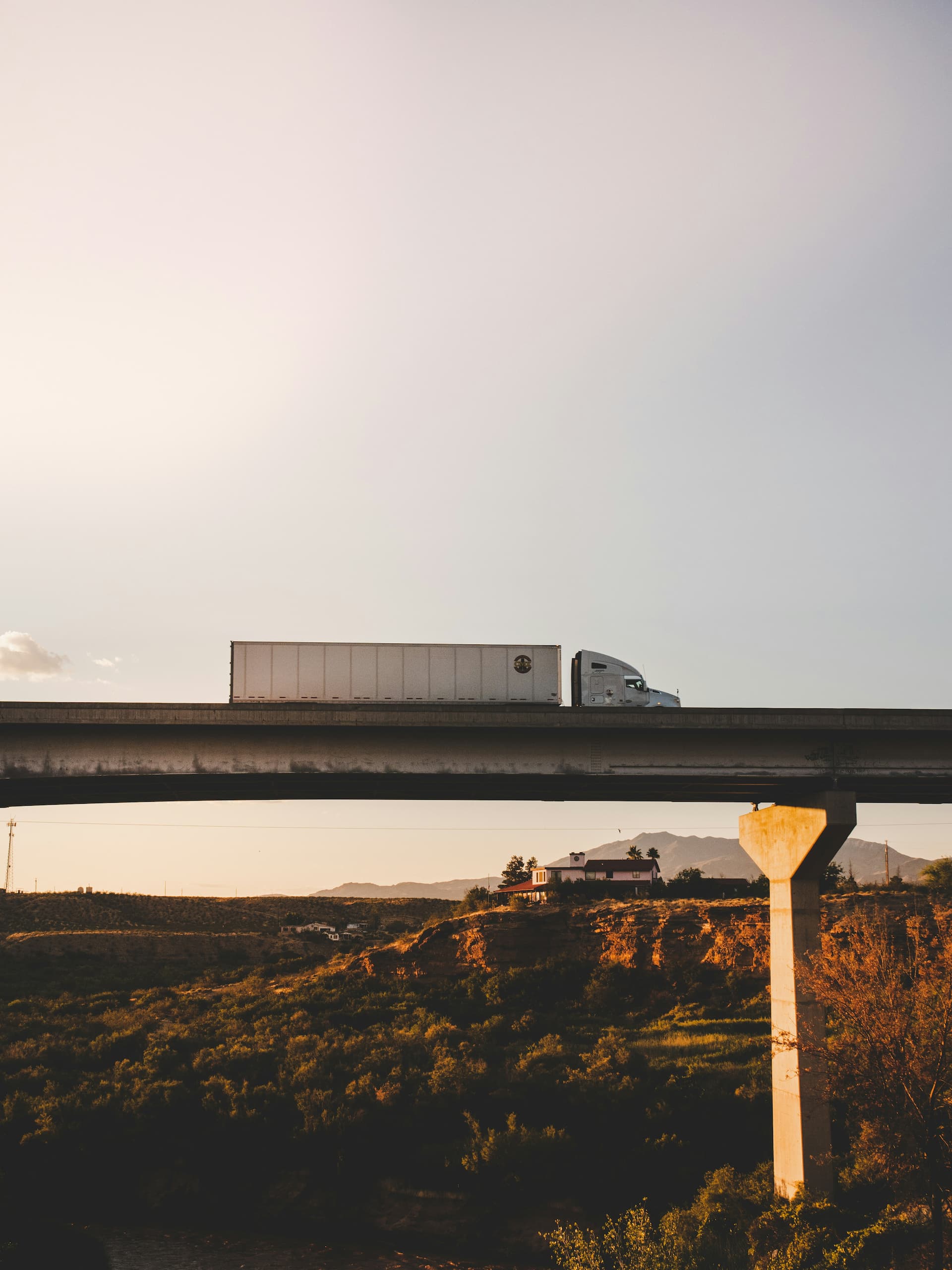 Truck on a highway bridge. Credit: Avi Richards, Unsplash.