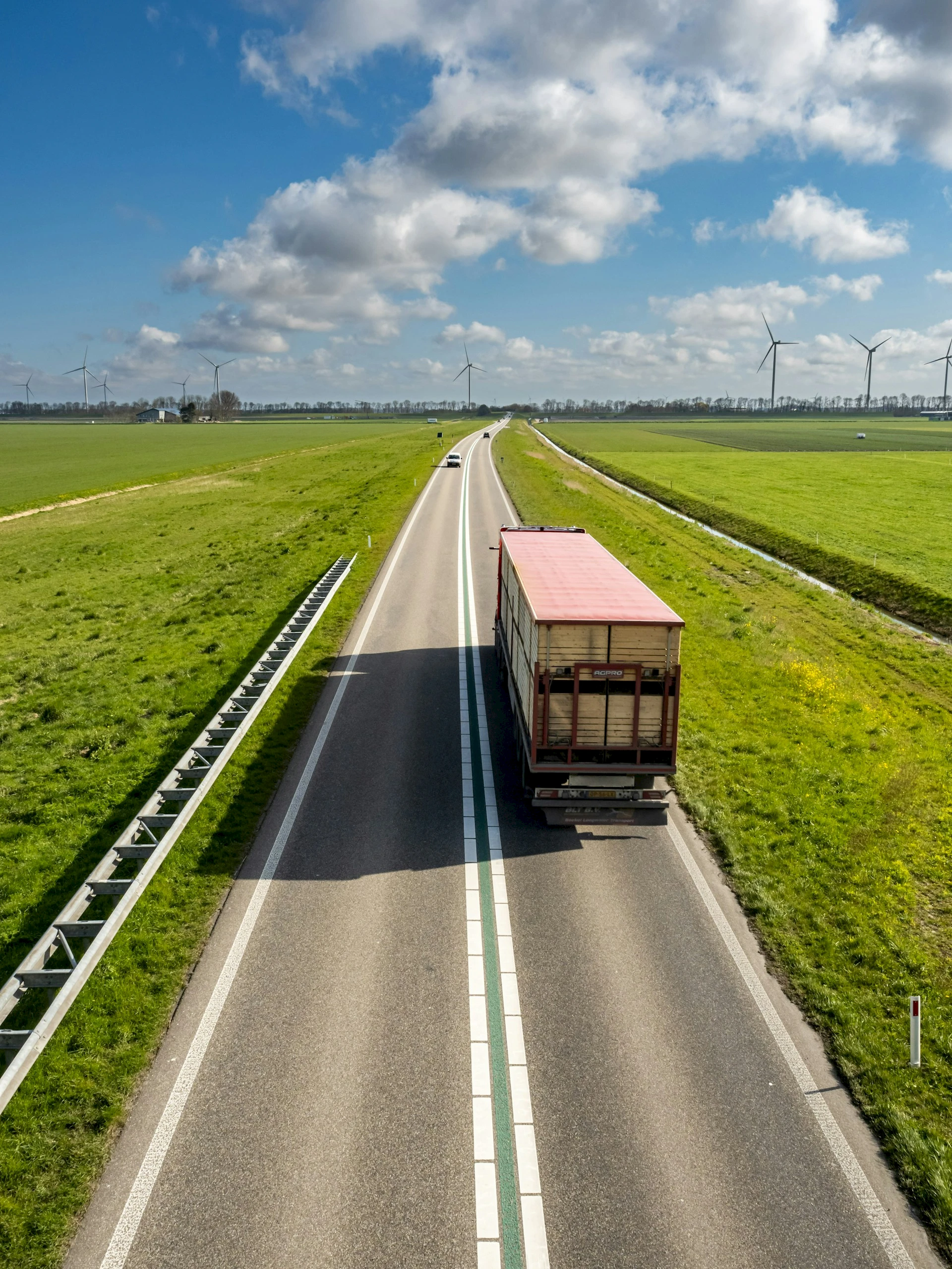 Truck driving on a rural road. Credit: Sven Brandsma, Unsplash.