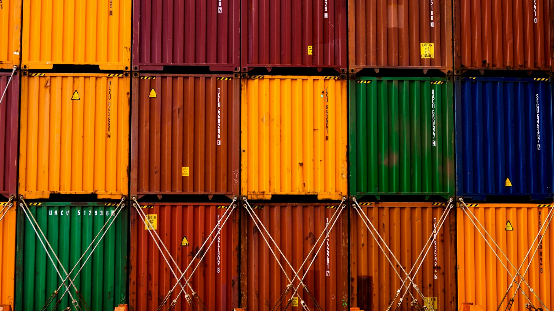 Stacked colorful shipping containers. Credit: Ishant Mishra, Unsplash.