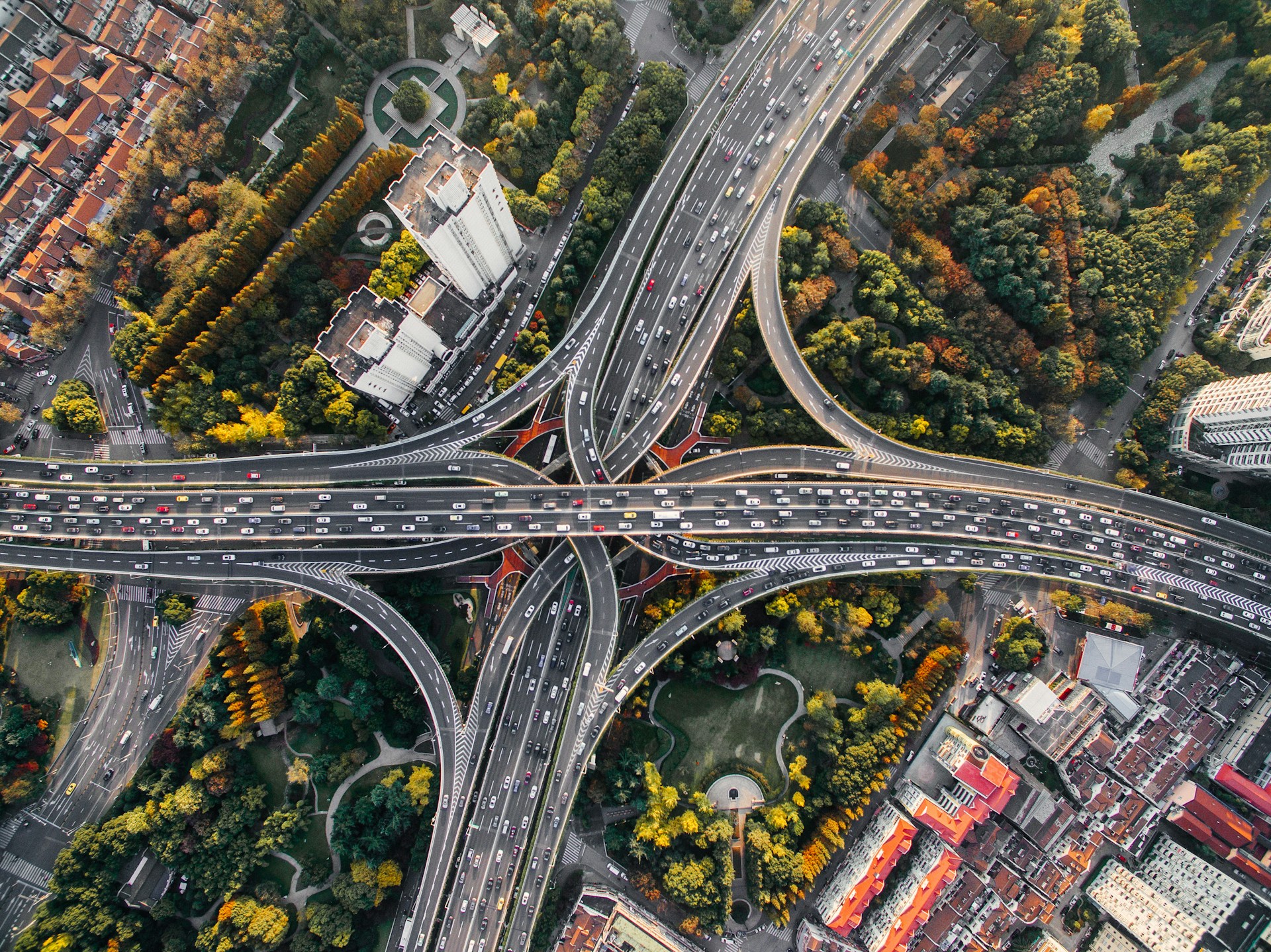 Aerial view of a busy highway interchange in a city. Credit: Denys Nevozhai, Unsplash